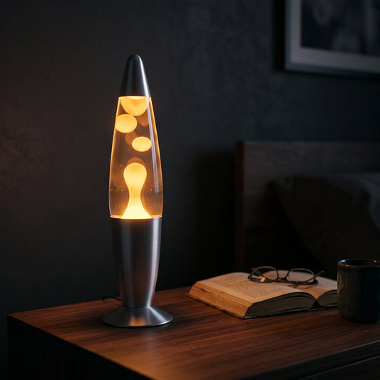 Volcano lava lamp on a bedside table — blue wax with glass cylinder and metal base