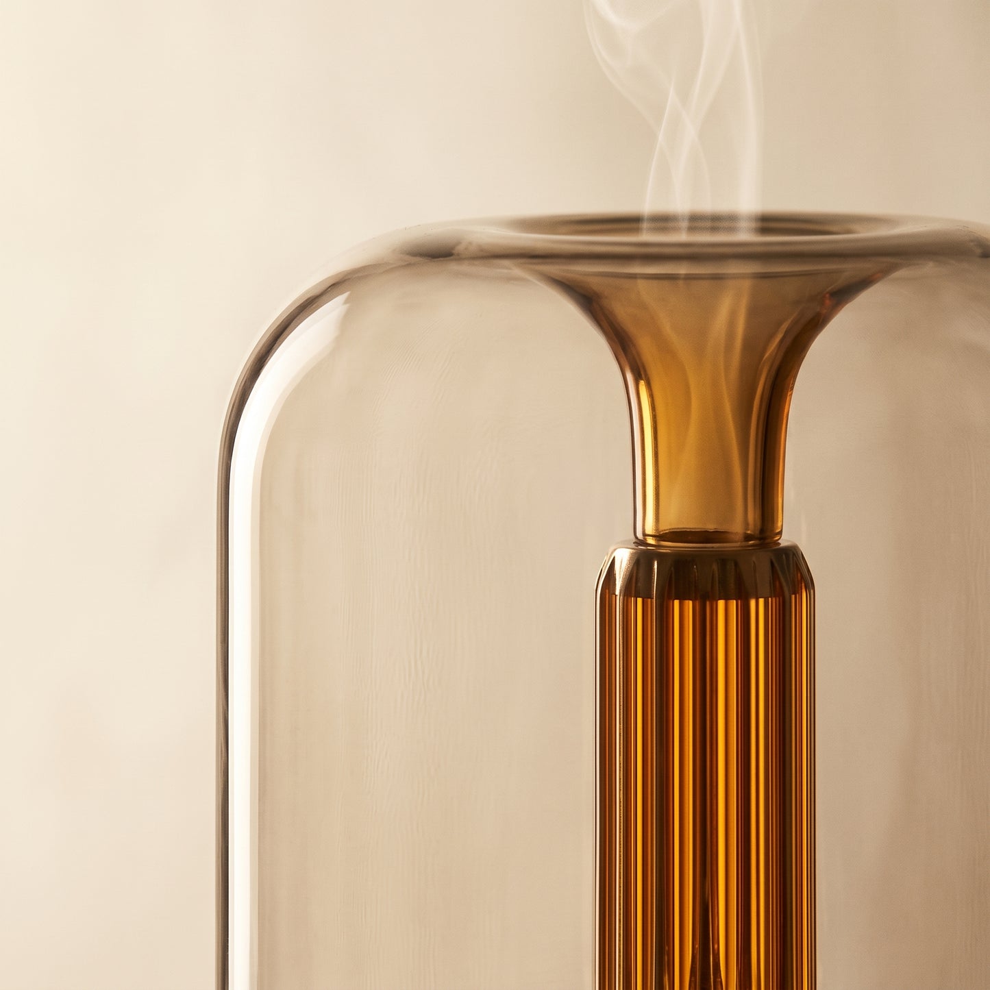 Close-up of the candlelight LED flame effect inside the aroma diffuser glass body