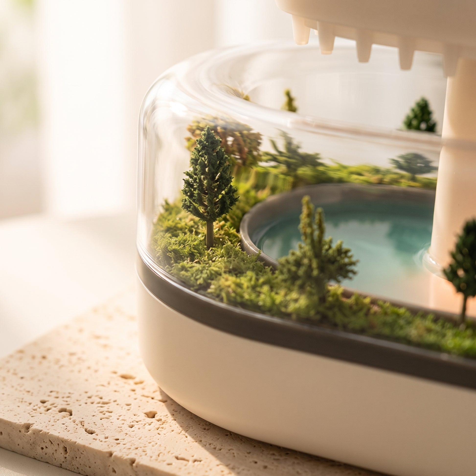 Close-up of the miniature water landscape detail on the rain cloud aroma diffuser base
