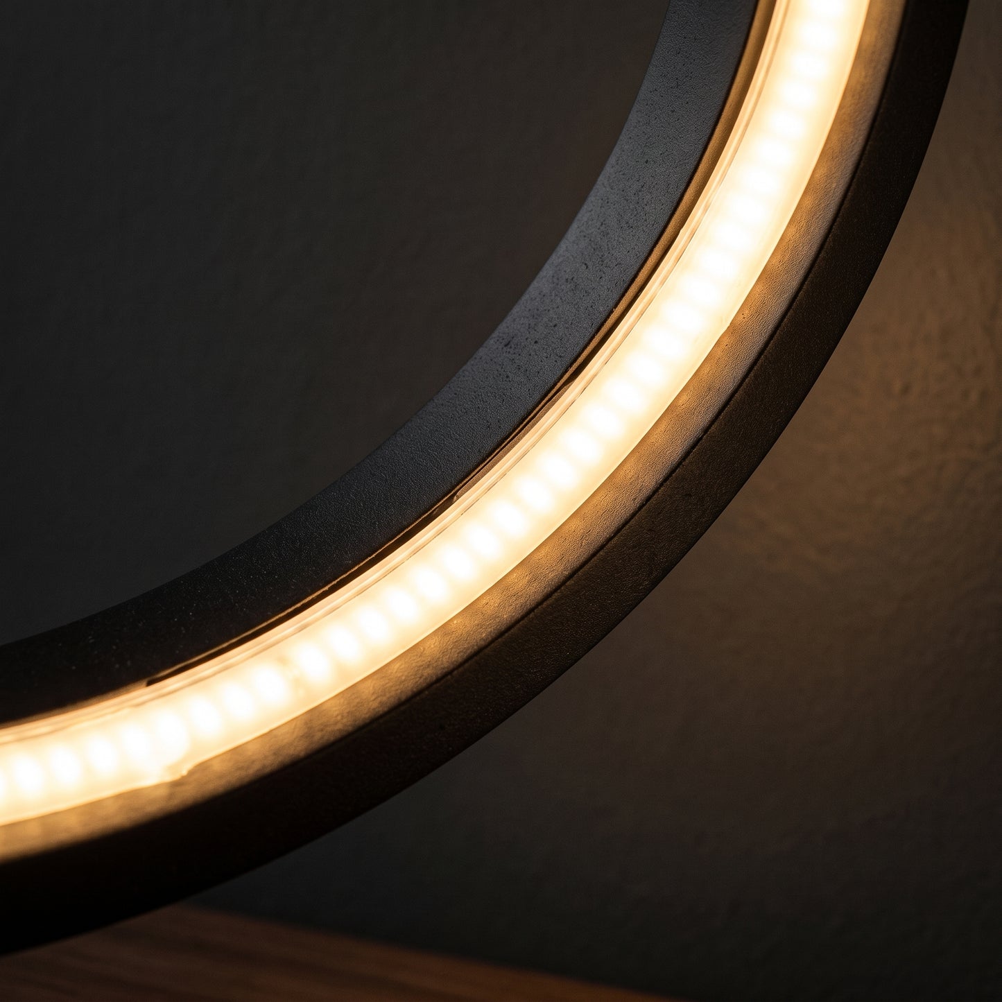 Halo ring lamp inner LED detail — warm light emanating from circular ring strip