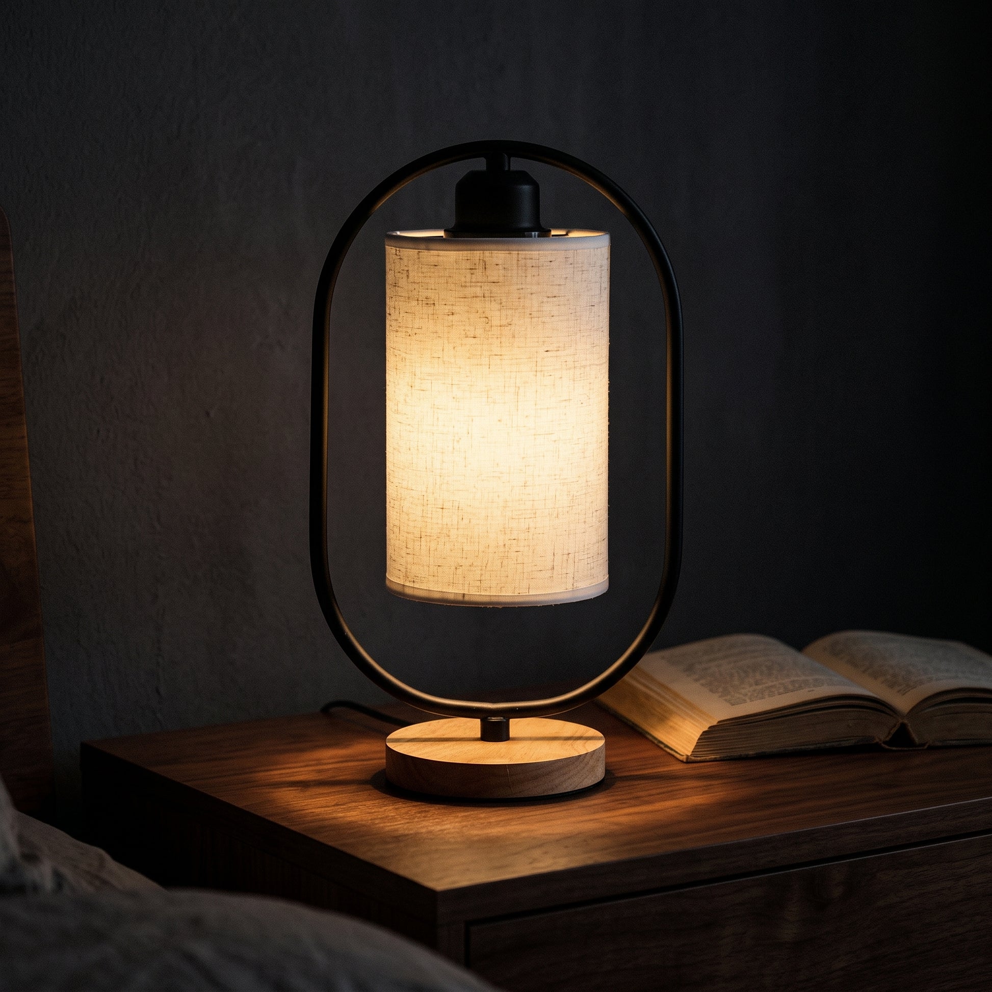 Minimalist bedside table lamp in white — slim cylindrical design with linen shade