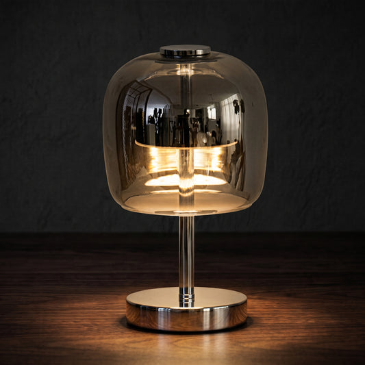 Nordic glass table lamp on a bedside table emitting soft tricolor glow
