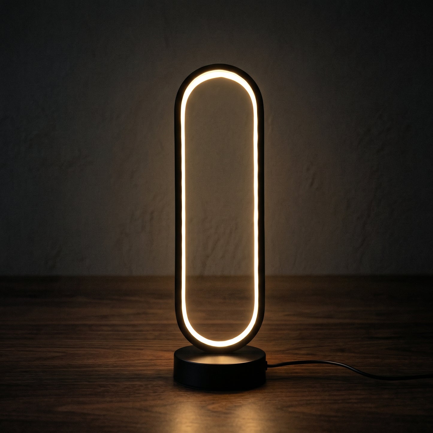 Halo ring lamp glowing on a bedside table — circular LED ring casting soft halo light