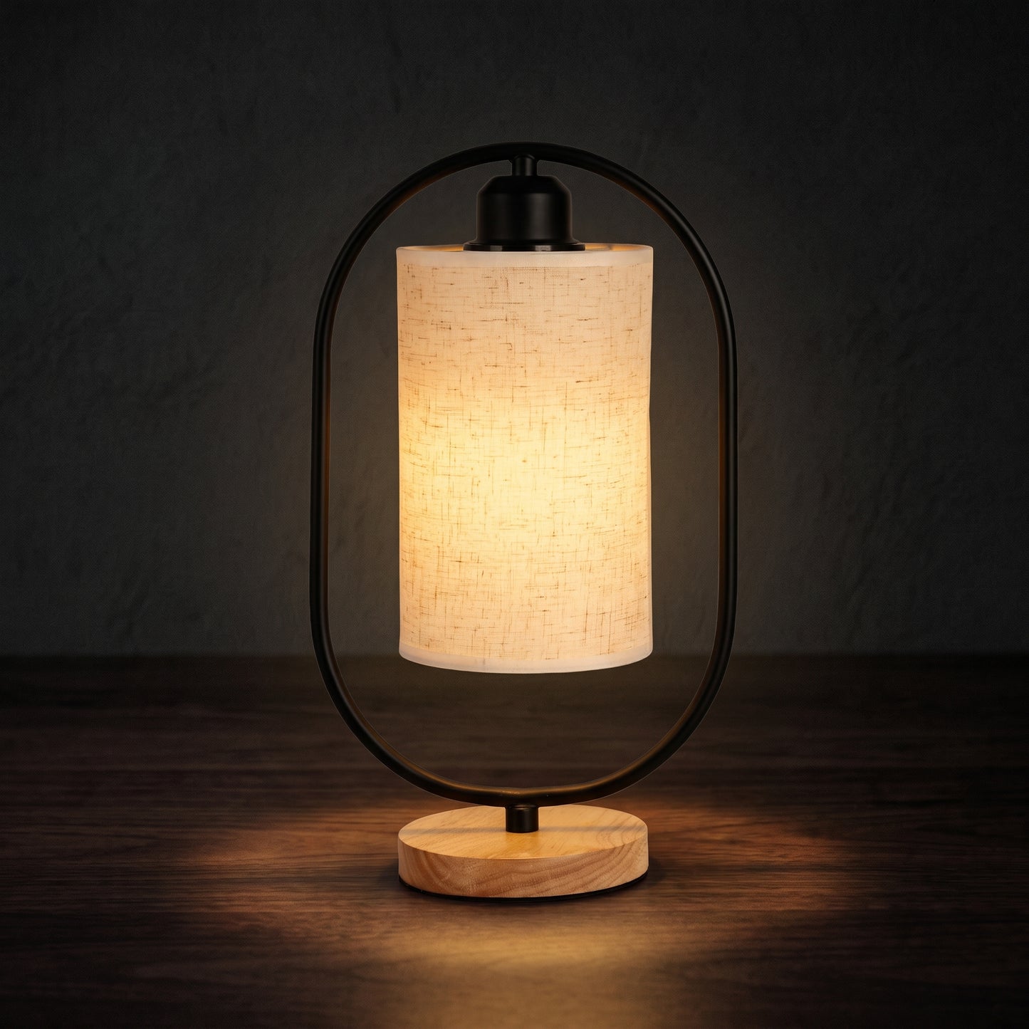 Minimalist bedside table lamp on a nightstand with warm LED glow in a dark bedroom