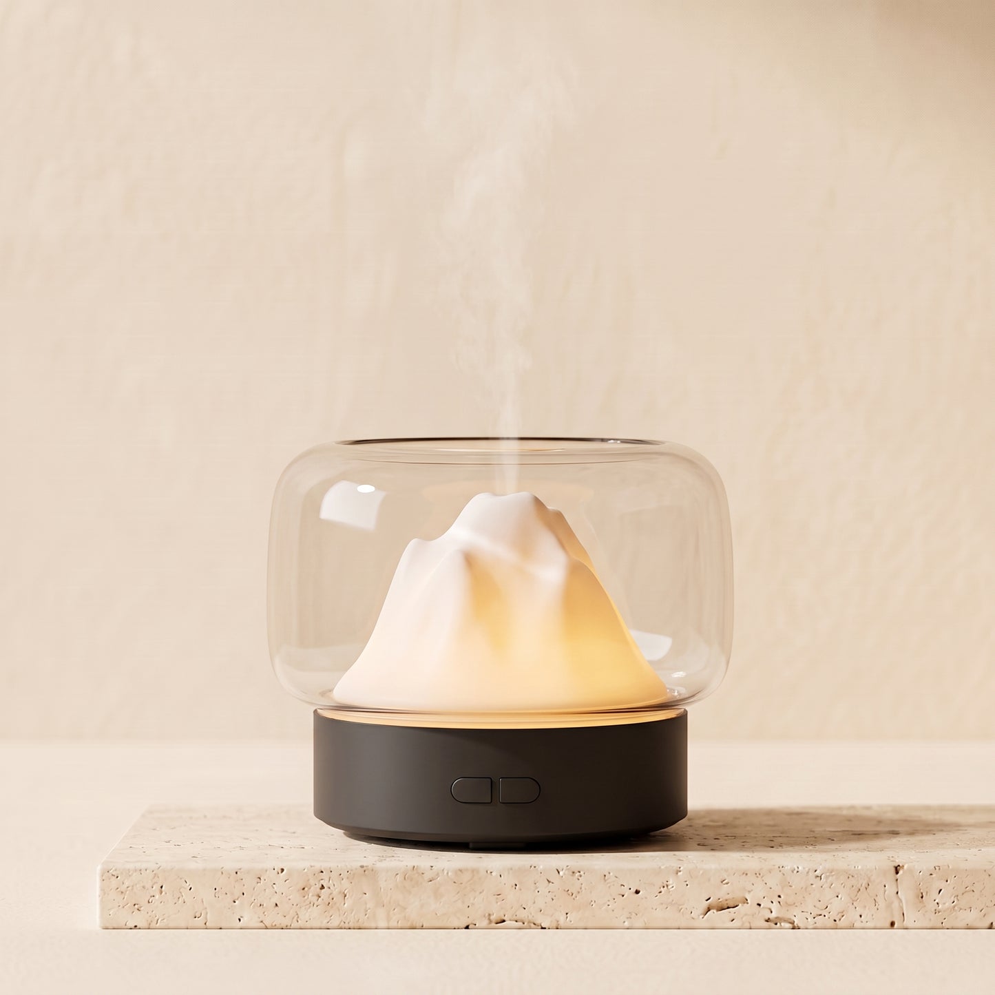 Mountain landscape aroma diffuser on a desk with cascading mist flowing over layered ridges
