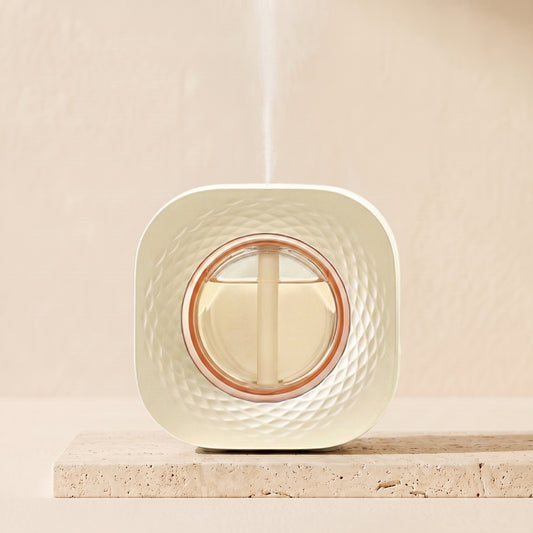 Wall and desk aroma diffuser mounted above a surface emitting fine mist: automatic interval diffuser
