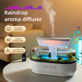 Haven& Rain Cloud Aroma Diffuser glowing blue LED on desk