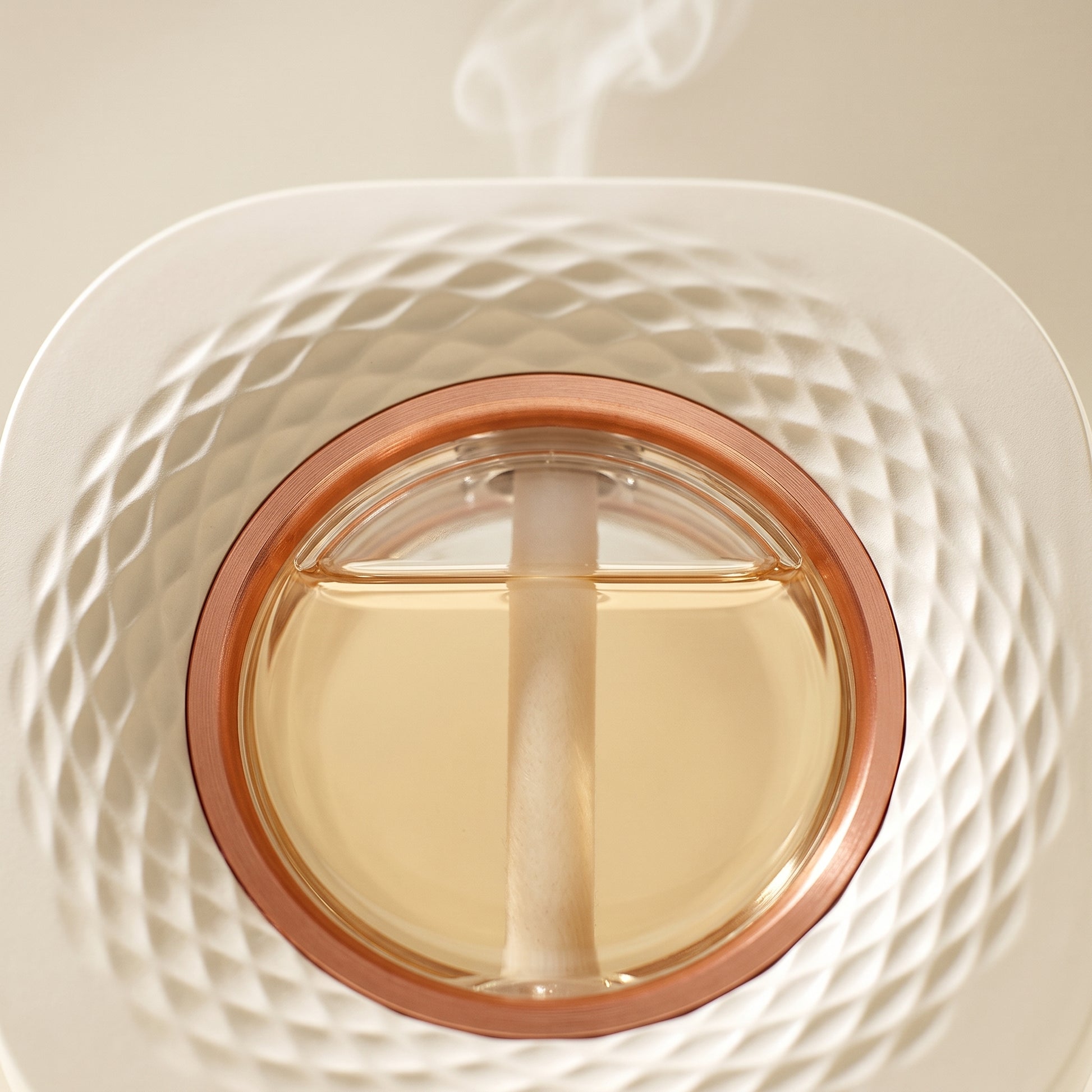 Close-up of the circular mist outlet on the wall and desk aroma diffuser