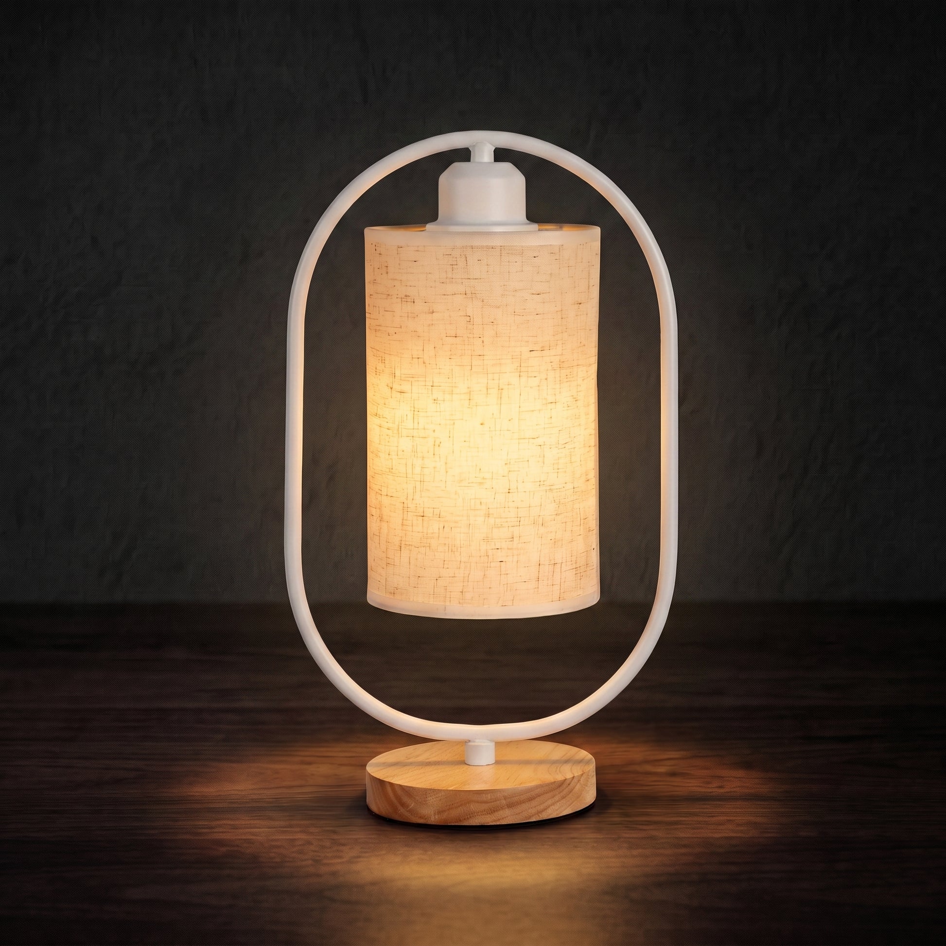 Minimalist bedside table lamp in black colorway — matte finish with warm LED glow