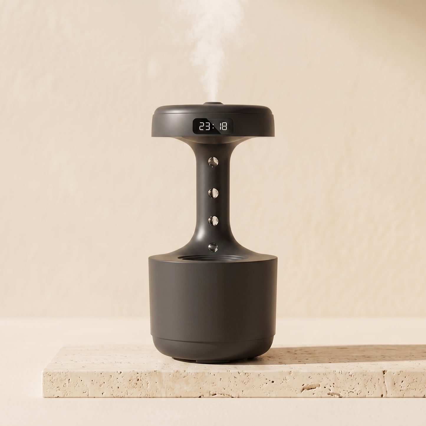 Levitating mist diffuser in blush pink colorway — warm LED clock display