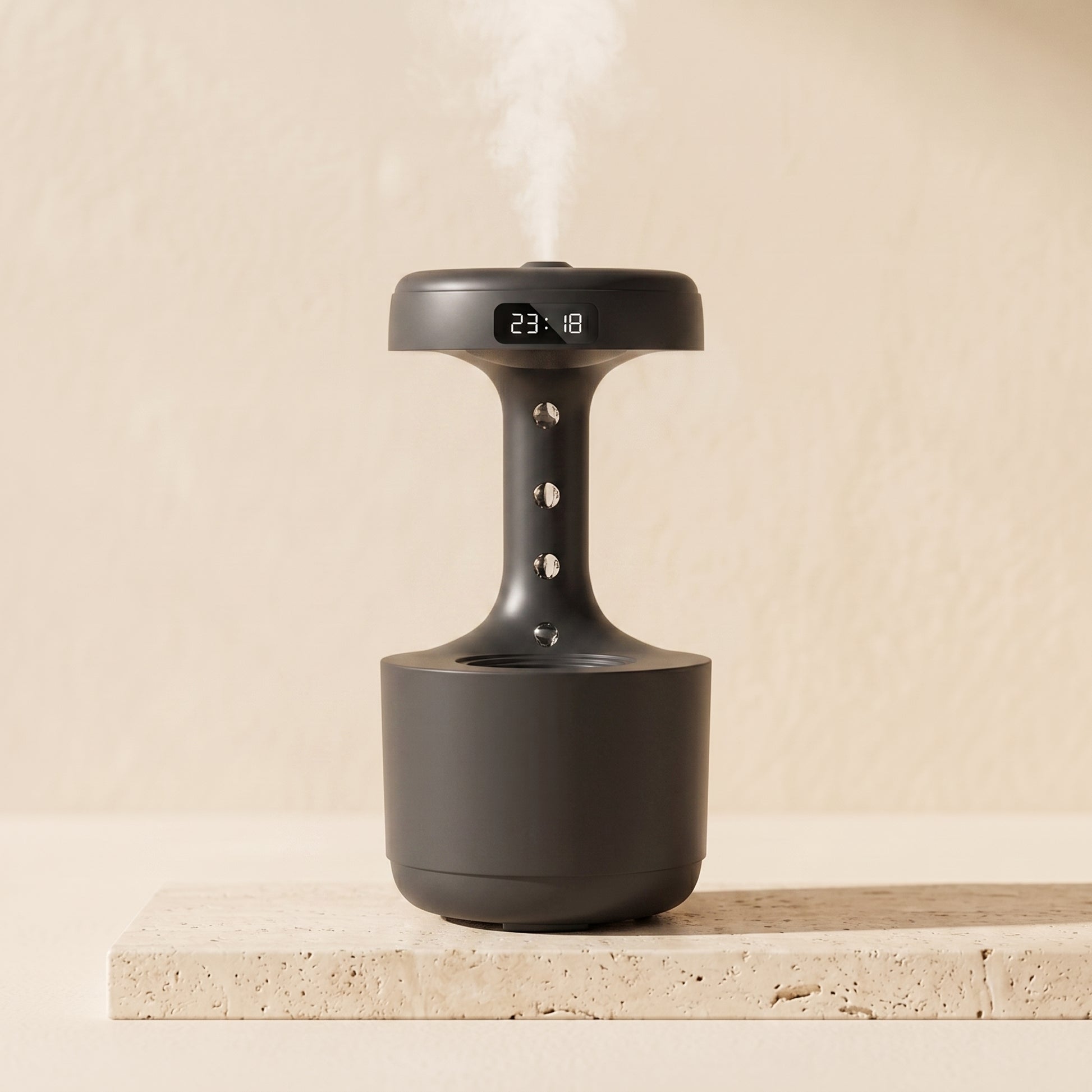 Levitating mist diffuser in blush pink colorway — warm LED clock display
