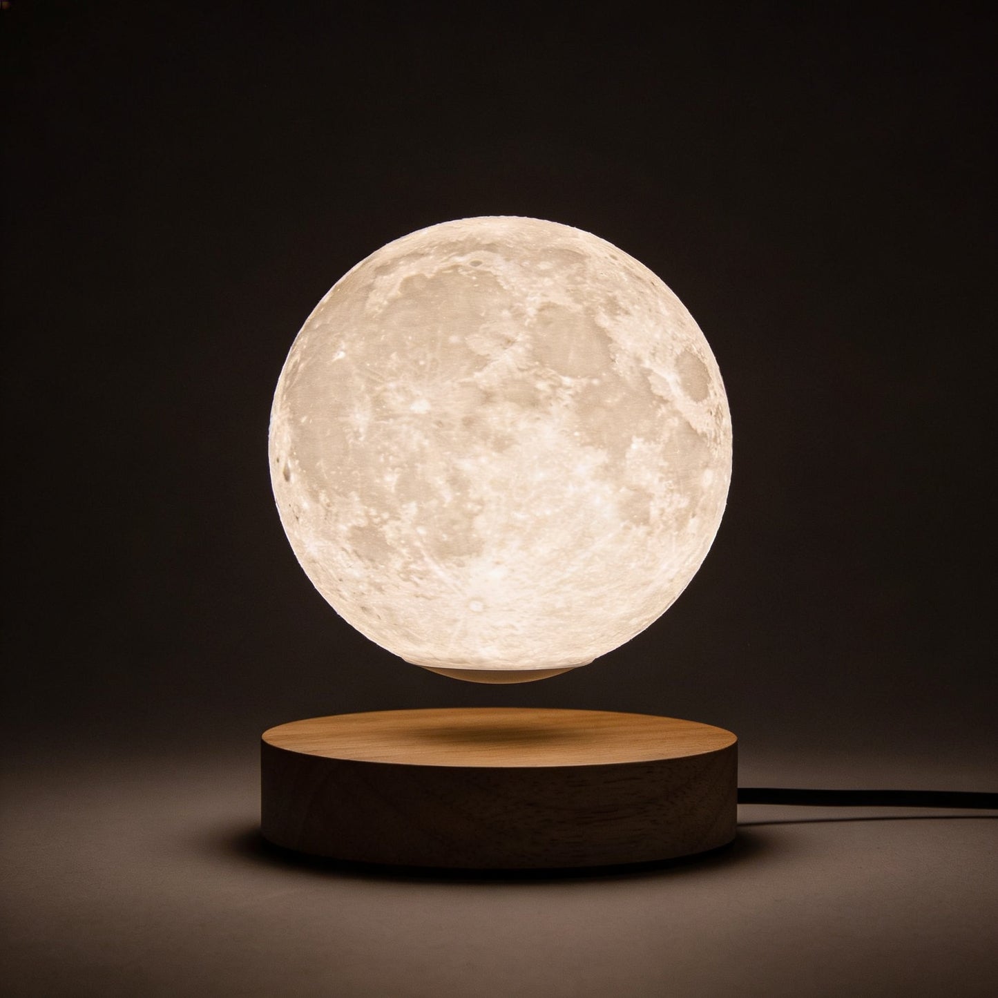 Levitating Moon Lamp product hero shot on dark background